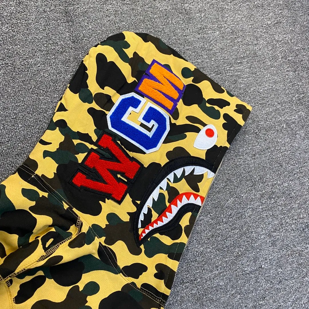XX 121 BAPE 1ST CAMO SHARK FULL Classic counter model Camouflage shark hooded zipper sweatshirt Machine-printed camouflage Top-quality fabric Premium 1:1 replica Customized fabric Couple model: S—XXL [Camouflage yellow, Camouflage green, Camouflage red, Camouflage purple, Camouflage blue, Camouflage gray]